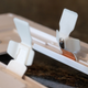 A set of prongs on the back of the SnapPower outlet covers allow them to automatically make contact with the wiring inside once installed and draw all the power they need.